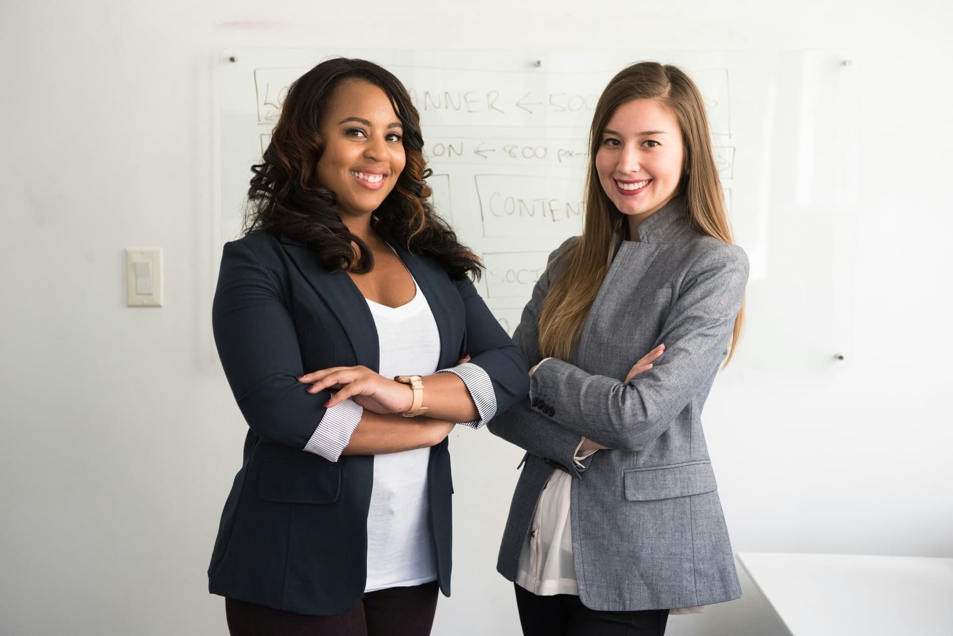 Two professional women collaborating in a modern office