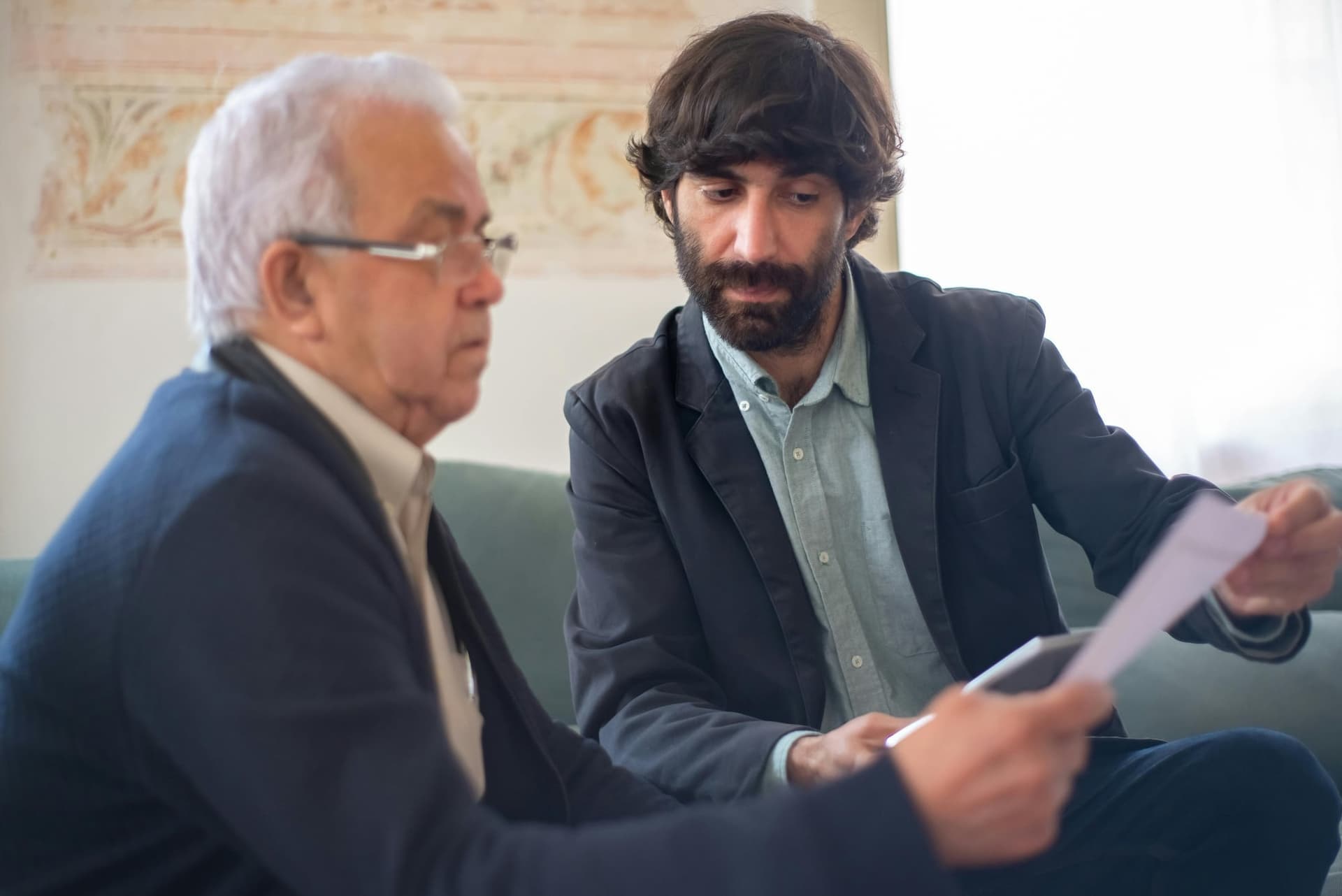 Professional advisor reviewing financial documents with client
