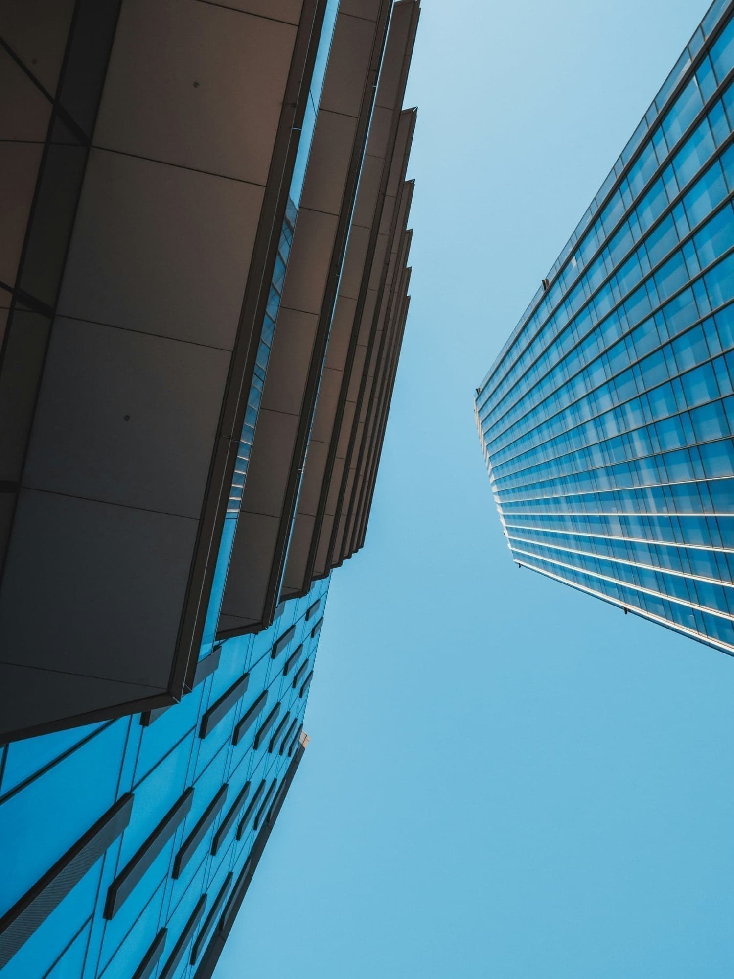 Modern corporate buildings representing institutional stability
